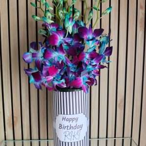 7 Blue Orchids in Glass Vase Arrangement