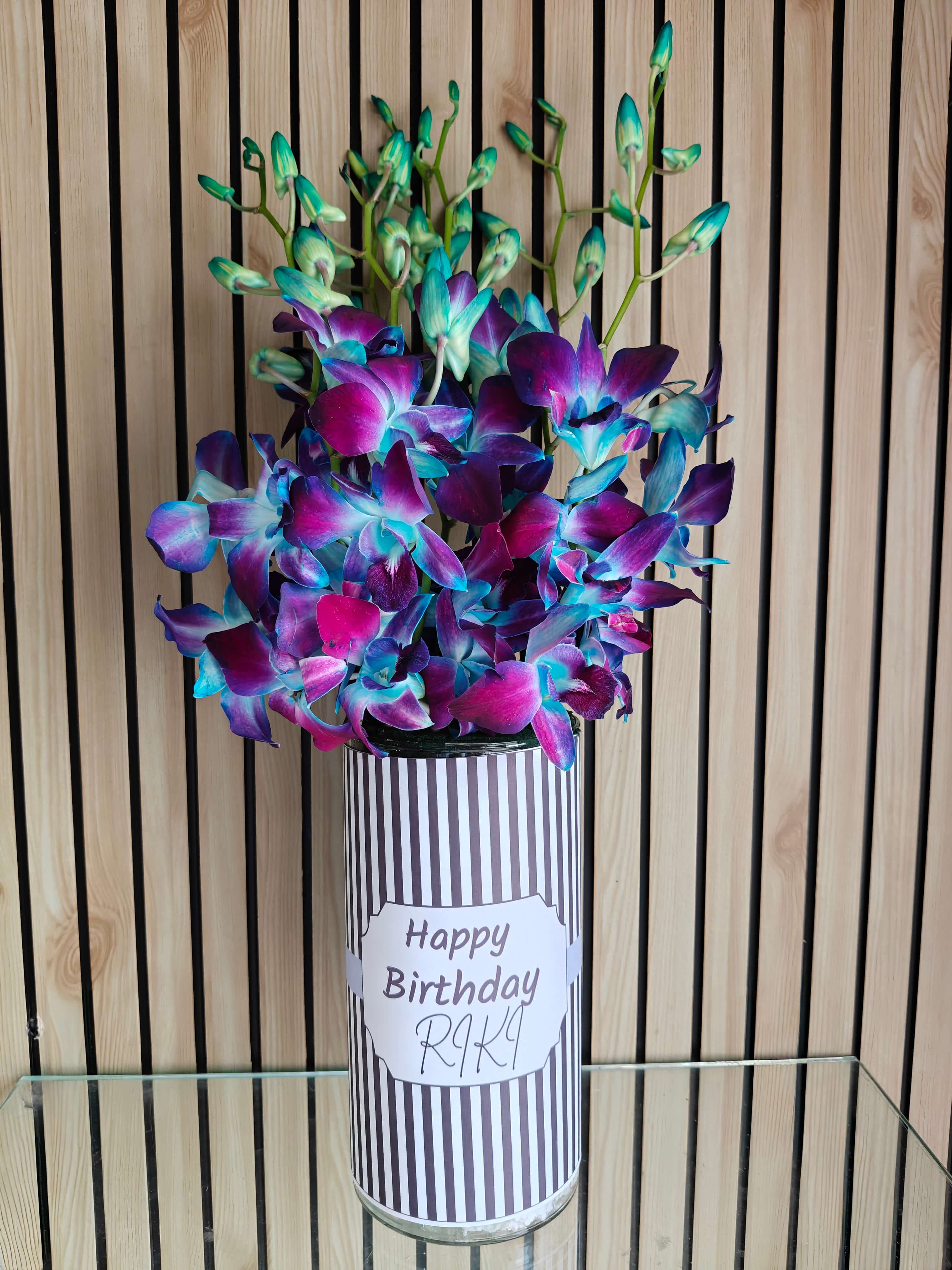 7 Blue Orchids in Glass Vase Arrangement